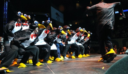 Members of the men's ice hockey team perform an interpretation of the film Happy Feet during Saturday's Thon 09 pep rally.